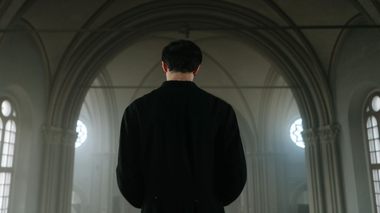 "A peaceful Christian setting with a Bible, communion bread, and a cup of wine symbolizing a quiet moment of reflection during a 2-minute communion meditation."